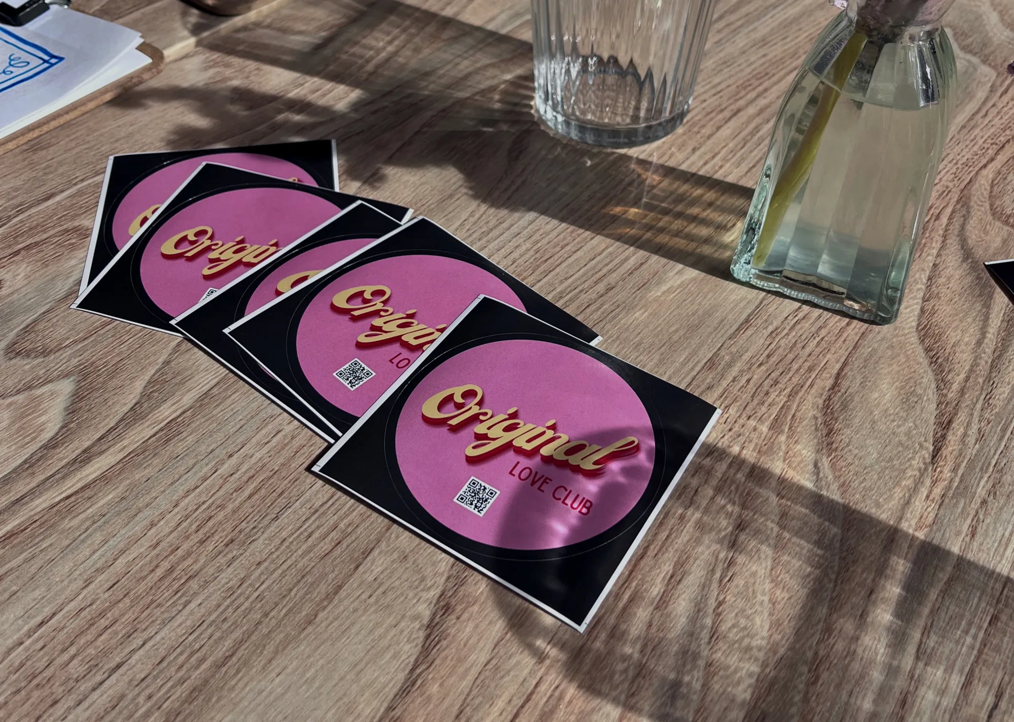Original Love Club stickers on a table